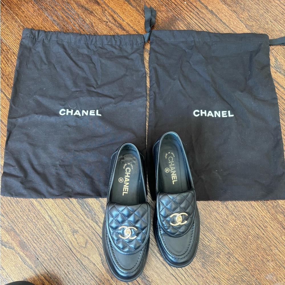 Chanel Black Loafers with Iconic Logo and Polished Finish